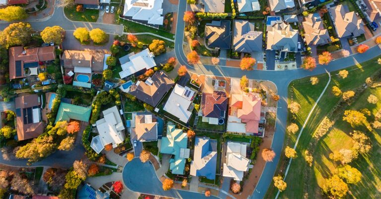 aerial view of suburban neighborhood GettyImages 834087898 1200w 628h